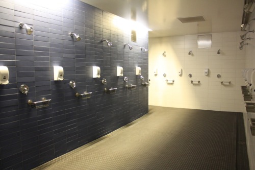The football locker room and shower at Simpson Center for Student-Athlete High Performance at the Un