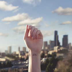 mymodernmet:  Photographer Austin Tott pairs the small with the grandiose in his series Tiny Tattoos. The delightful images feature hand-drawn body art that’s positioned against a background from which they visually reference. 