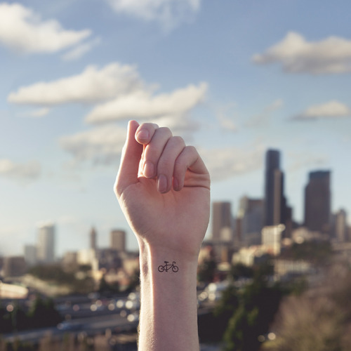 mymodernmet:Photographer Austin Tott pairs the small with the grandiose in his series Tiny Tattoos. 