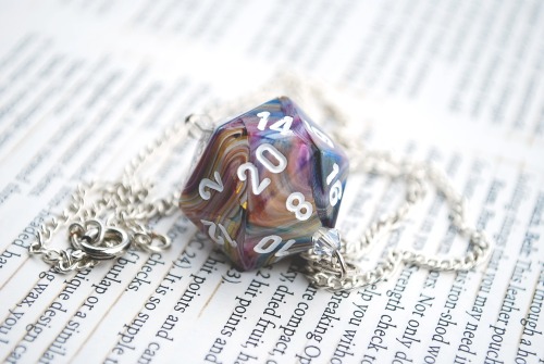 This is a beautiful Calico Swirl D20 (20 sided die) with white printed numbers. It is blue, purple, 