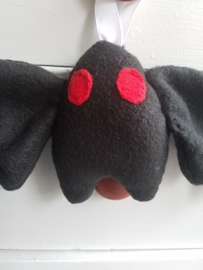 olliedinsmore:  This charming, hand sewn Mothman ornament can now be found at my
