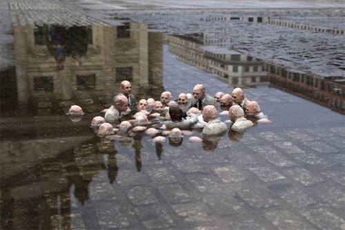 jessehimself:  This sculpture by Issac Cordal in Berlin is called “Politicians discussing global warming.”