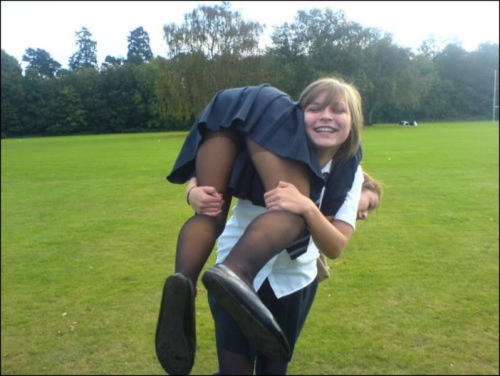 schooluniformpantyhose:  Low denier black tights adorn the legs of the girls in this image.