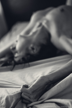 deepestdesires:  The only thing holding me to the bed… … those sheets. I can barely keep my grip. You play me so well. Leaving me trembling. Weak. A quivering mess. Whimpering. Your name a plea for more on my lips. You pause. Looking up. That deliciously