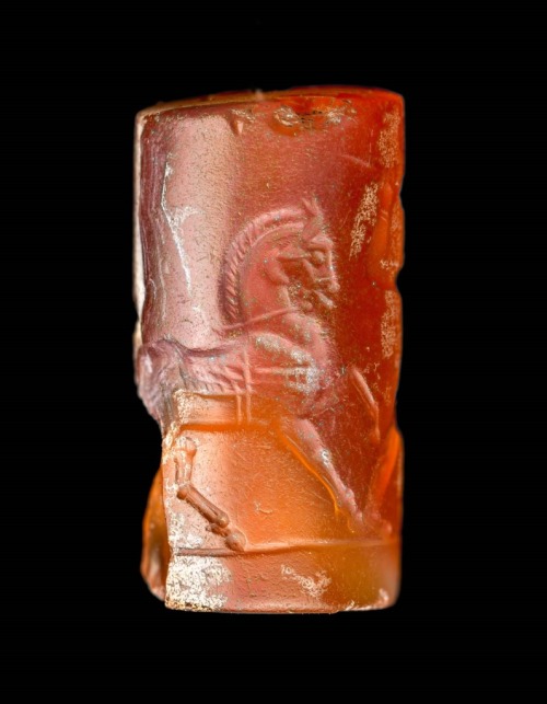 Cylinder seal with Persian hunter and horse, carved in sard. Persian Achaemenid period, 550-331 BCE