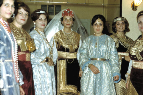 ofskfe: Moroccan Jews wearing traditional kaftans at a pre-wedding henna party. The bride (center) i
