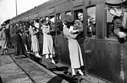 historicaltimes:  Soldiers departing for Egypt from Feltham Station  lean out of their windows to kiss their loved ones goodbye via reddit