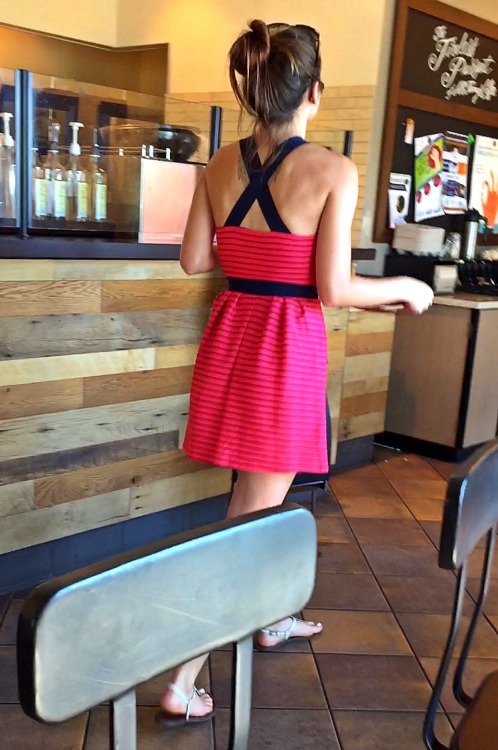 Sexy hot chick&rsquo;s beautiful face and pretty feet with white toenails candid at the coffee shop.