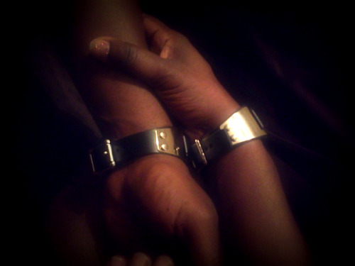 kinkybutterfly:  Matching leather & chrome wrist cuffs! More symbolism… We’re each wearing these beautiful cuffs complete with that intoxicating leather smell and the cold smoothness of motorcycle chrome. I love these! Thank you Sir! 