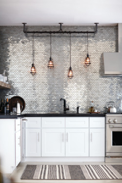 designmeetstyle:  Vintage industrial. Add shine and sophistication with an urban edge to your kitchen. Incorporate this style with bold details, like metal mosaic tile and cage pendant lighting. Get the look.