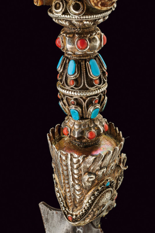 Tibetan phurbu decorated with silver, red coral, and turquoise, late 19th century.from Czerny’s Inte