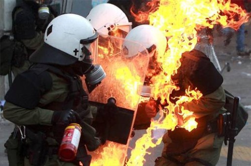 irishrepublicanarmy: British Riot Police burning.