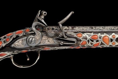 Silver and coral mounted flintlock pistol originating from Algeria, 19th century.Estimated Value: €3