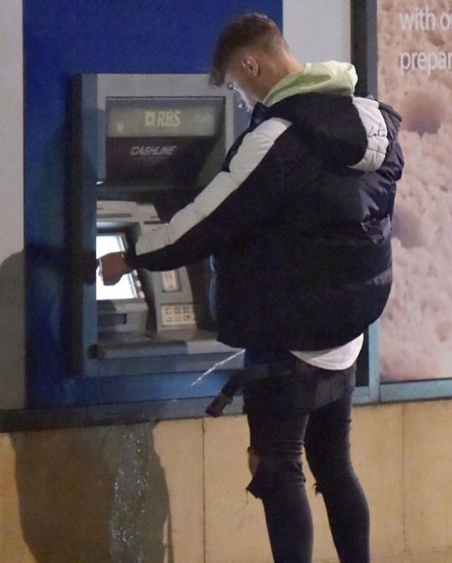 adamandstevewerehot: Here’s a man multitasking. Withdrawing money from his ATM in order to pay the t
