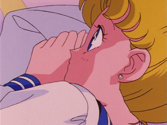 A closeup of Usagi as her eyes flutter open, startled.