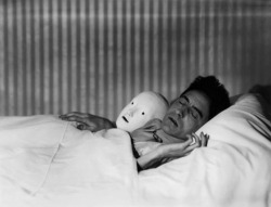 Berenice Abbott - Jean Cocteau in Bed with Mask, Paris, 1927