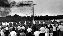 whitetears365:  thesociologicalcinema:    Knights of the Ku Klux Klan march in a circle around a 50-foot burning cross on June 6, 1965, as approximately 2,500 watched the closing ceremony of the rally near Trenton, North Carolina. Photo credit: AP —