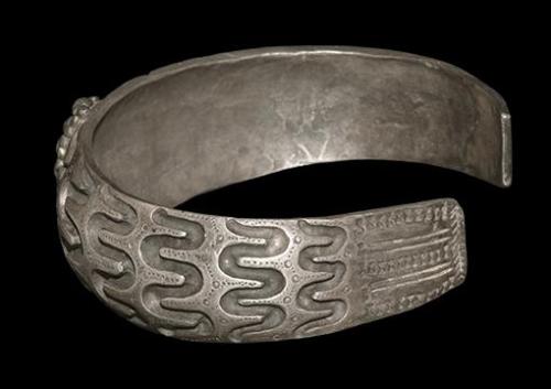 archaicwonder: Viking Orupgard Type Bracelet, 10th Century AD A silver penannular bracelet with carv