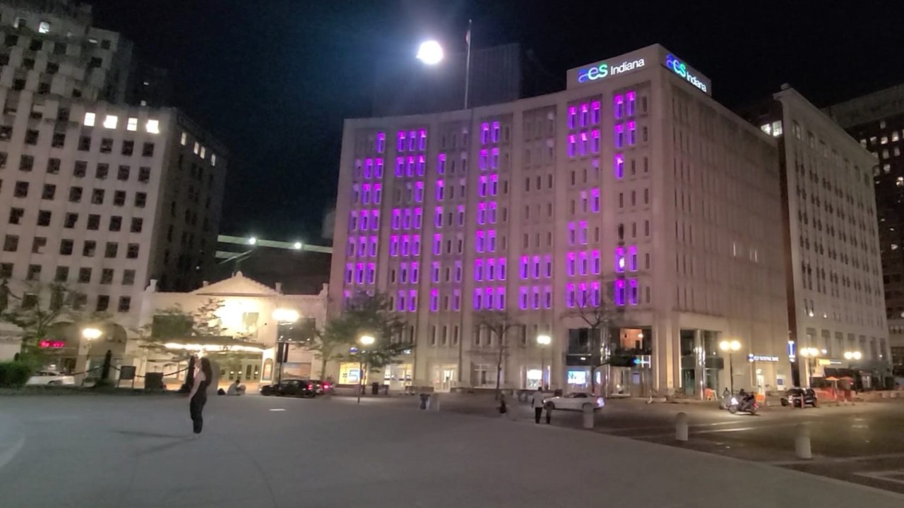 The AES building in downtown Indianapolis is lit in purple "ALZ" for awareness