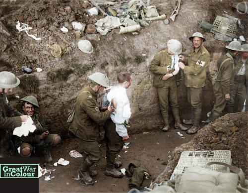 Medics help wounded Canadian soldiers during the Battle of Courcelette.Original image source: Librar