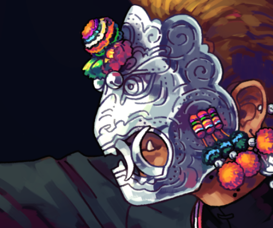 Drawing of a silver metal mask shaped like a snarling animal. It has colorful pompoms and tassles hanging from it.