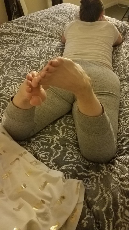 My pretty wife laying in bed texting on her phone.please comment
