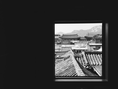 View of hanok roofs, the old Jongchinbu (Joseon Dynasty ministry of royal genealogy) and Mt. Inwangs