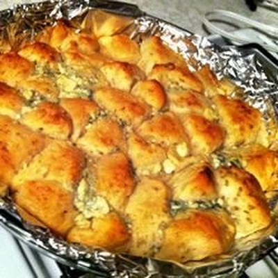 A package of refrigerated biscuits gets the deluxe treatment when brushed with butter mixed with blu