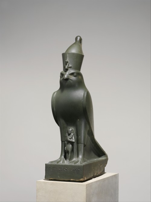 egypt-ancient-and-modern: The Ancient Egyptian god, Horus, protecting Pharaoh Nectanebo II