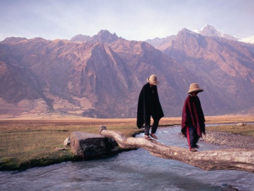 praial:Two villagers traverse a small stream in a valley of Peru’s Cordillera Blanca (white mountains). The Cordillera Blanca are home to Huascaran mountain, which is the tallest peak in all of Peru’s cloud-piercing Andes.