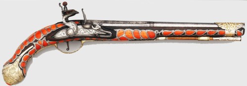 peashooter85:A Turkish flintlock pistol mounted with silver, brass, and red coral, 19th century.