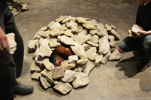 doctorsherlocklokison:  janemba:  theletteryogh:  colorthefuture:  Ruins (2015), Carlos MartielI lay in the fetal position naked on the floor of the gallery, two Caucasian men covered me with rocks until my body became invisible.  is this art?If so,