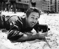 life:  Today marks the 90th anniversary of the founding of the Walt Disney Company. We look back at a photograph of Walt Disney with his little 8mm movie camera — on a beach in Brazil, of all places. (Photo: Hart Preston—Time &amp; Life Pictures/Getty