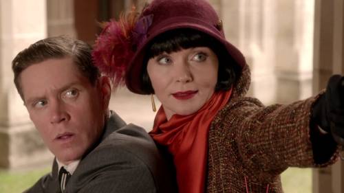 Miss Fisher’s sixth outfit worn in “Blood of Juana the Mad” (Season 2, Episode 8) is a rich brown tw