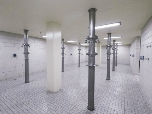 Men’s shower room at the North Gym, University of Minnesota - Minneapolis.There are two locker