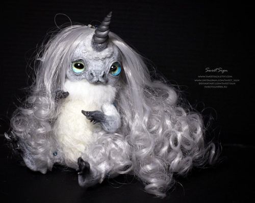 Silver unicorn. She seems to be made of cold moonlight, fog and winter stars, her skin is glowing wh