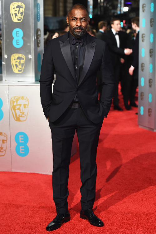 awardseason:   Idris Elba attends the EE British Academy Film Awards at the Royal Opera House on February 14, 2016 in London, England.   I have no structure for this man.