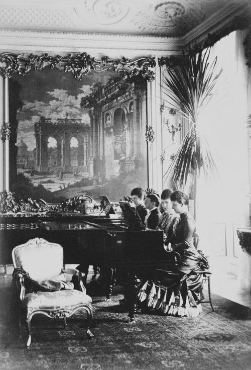 theimperialcourt: Queen Louise of Denmark with her three daughters at the piano. From left to right 