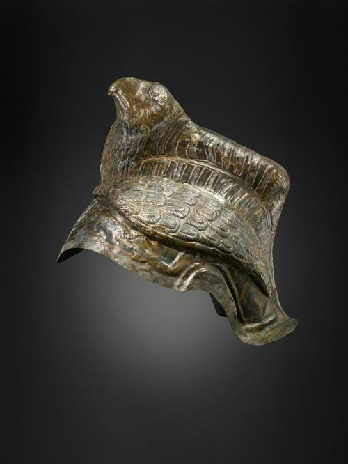 Roman parade helmet, bronze with brass plate and tinned, with an eagle in relief. 100-200CE.