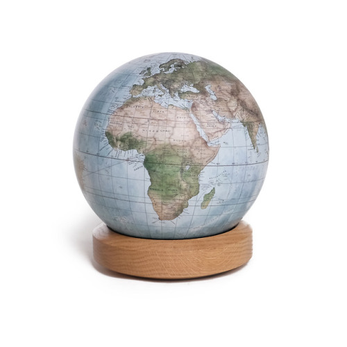 Earth from space! This style of globe is reminiscent of the famous Pale Blue Dot photograph. Painted