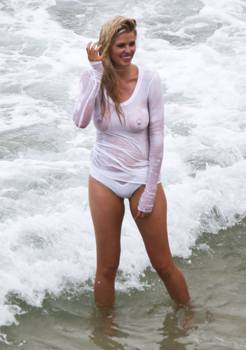 toplessbeachcelebs:  Lara Stone (Dutch Model) in a wet see-through top during a photoshoot in Sydney (January 2016) 