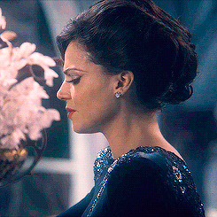  The thing with the Genie is that we get to see Regina genuinely… struggling with allowing him to take the fall, until the moment when he makes his terribly worded wish. And then what we get is that beautiful, beautiful triumphant smile.   She can