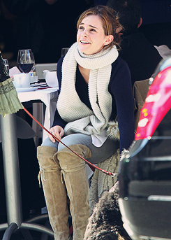 fiftyshadesen:  Emma Watson gives a scratch to a passing dog as she enjoys lunch