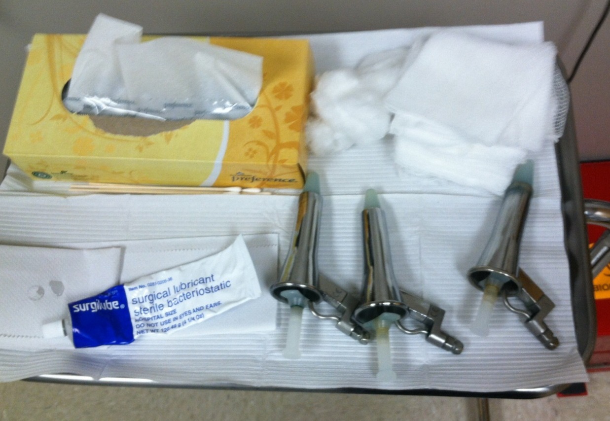 gynie-ville:  At the proctologist, she leans over the tilt-table for a thorough rectal