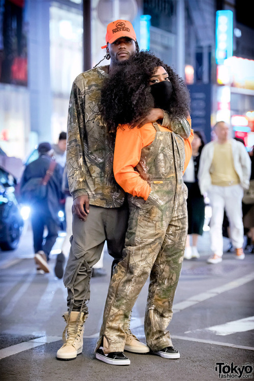 tokyo-fashion:  Nene (a designer) and Brahim (an artist) on the street in Harajuku wearing matching hunting gear inspired looks including camouflage by She, a Redhead cap, and Vans sneakers. Full Looks