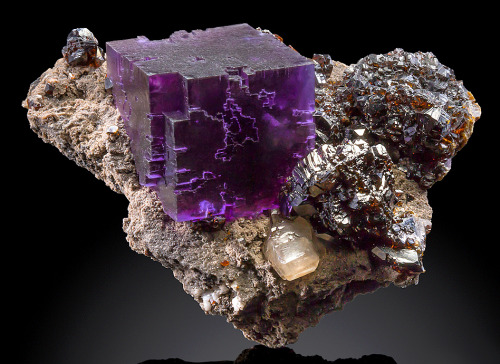 mineralists:  Fluorite cube with Calcite and Sphalerite on matrix Denton Mine, Illinois