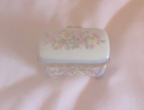 childofsinister - one of my grandmothers old porcelain tins