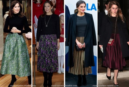 royal ladies in black tops and midi skirts