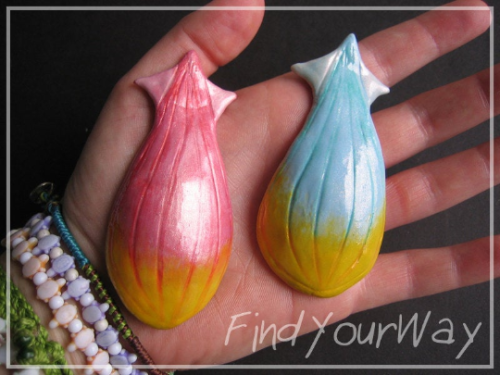 thalassa shell cosplay props.  sculpted from resin, painted with enamel.