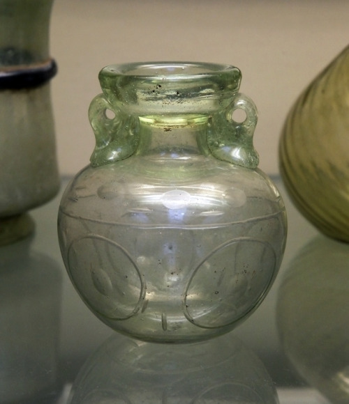 Ancient Roman glass flask with cut decoration.  Artist unknown; 3rd cent. CE.  Now in the British Mu